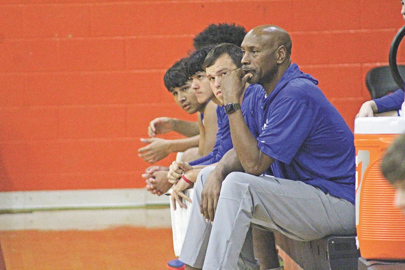 Coach Carlton McKinney watches his Mustangs during a recent varsity basketball game. McKinney was the guiding hand behind the Nixon-Smiley athletic program as athletic director for the past 16 years.