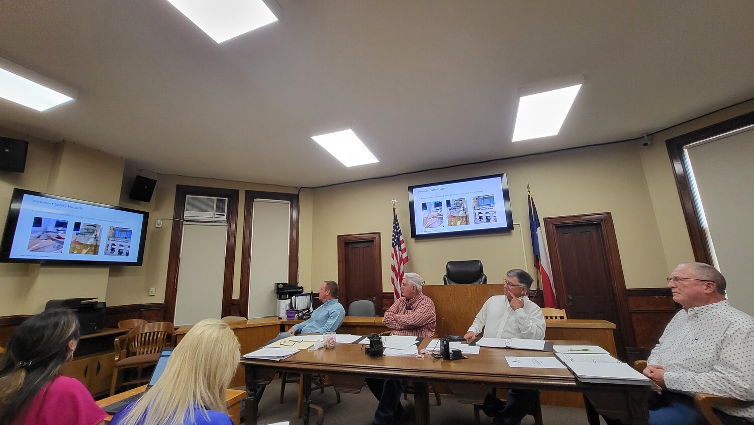 ohn Duke of CPM speaks to Gonzales County commissioners about the findings by Wiss, Janney, Elstner Associates (WJE) engineering firm regarding the facade at the Randle-Rather building downtown.