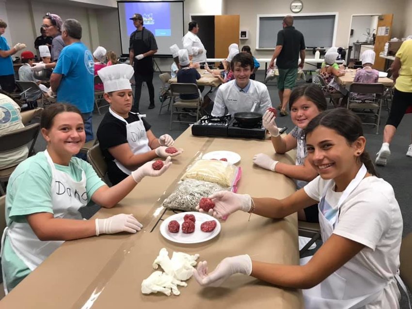 Lillian Cattle Company came to explain the difference between grass-fed and grain-fed beef and made sliders with Expect Excellence Culinary Camp attendees in 2021. Jonathan Kastner has been working with the culinary camp since its first year.