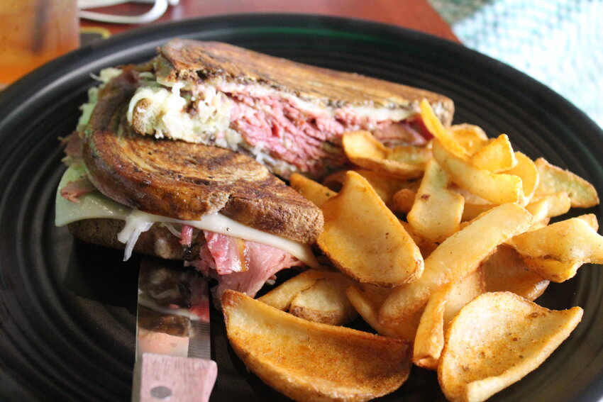 The Reuben which is piled with housemade corned beef brisket, Swiss cheese, sauerkraut and Jameson-Russian dressing on marbled rye.