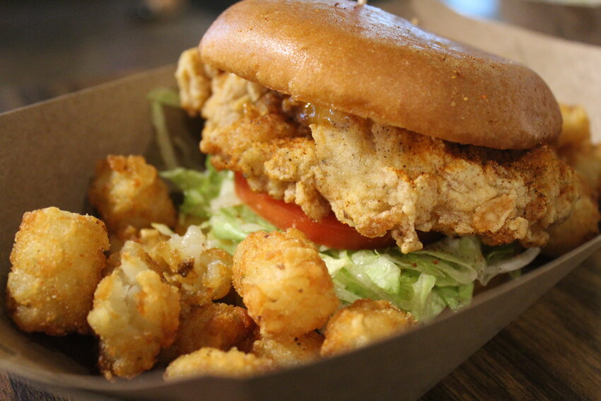 The fried chicken sandwich is served on a hearty brioche bun that stands up to the crunchy and juicy fried chicken thigh. The chicken was well dusted with Mercury Dust which lent a building heat while the Tang aioli helped balance the heat. The sandwich is also topped with housemade pickles, lettuce and tomato and comes with a side of tots.