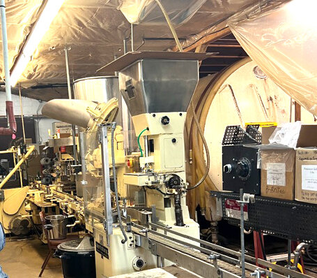 The bottling room with a wine vat in the background. / Harriet Outlaw, GCM Contributor