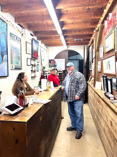 The staff at Perdido Vineyards share their passion for the winery with every visitor. Pictured are Theresa Grundman, manager William Sangster and winemaker Lee Newton in the retail shop. / Harriet Outlaw, GCM Contributor