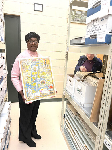 A collection of Walter Overton's work is housed at the Baldwin County Department of Archives and History in Bay Minette. Director Felisha Anderson shows one of his maps of Baldwin County.