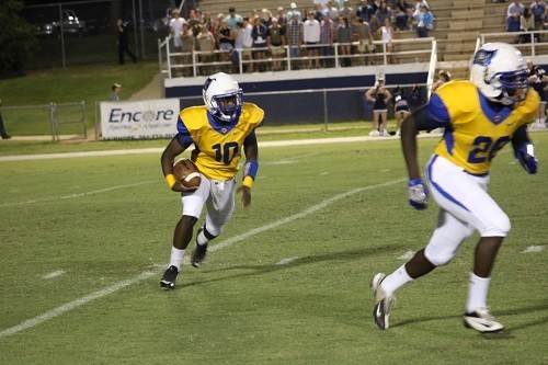 Quarterback Devin Mitchell gets blocking from Darnell Bell.