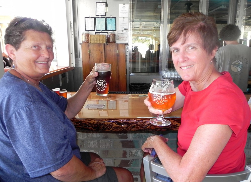 Monica   Shelton,   left, and   Carolyn   Bauer enjoy   a brew.