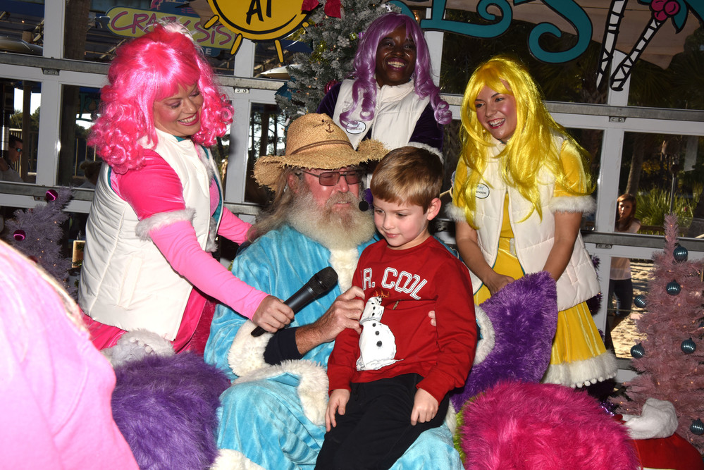 Jackson   Hughes   visits with   Billy Claus   and the   LuLubelles.