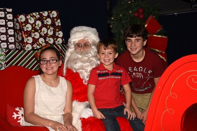 Zach, Abby   and Carter   Bourgeois   with Santa.