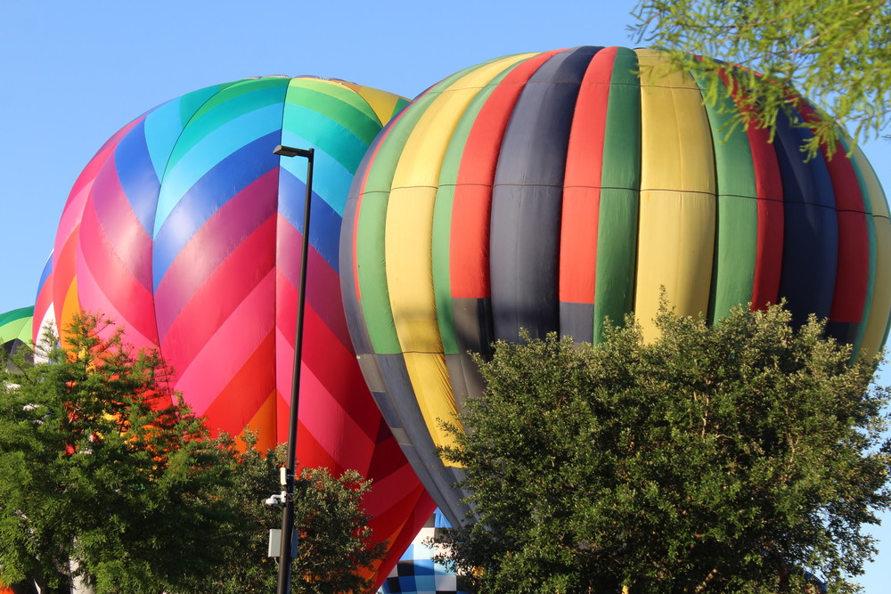 Despite the strong winds on Saturday, May 6, preventing the pilots from taking their balloons into the air, early birds were able to catch a glimpse as the pilots inflated the balloons in the Foley Sports Complex fields.