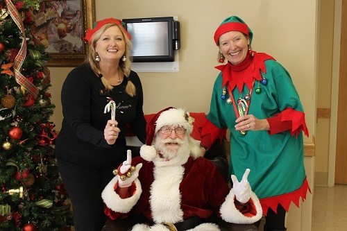 The Blake at Malbis Outreach Coordinator Susan Cox, left, and Robertsdale Rehabilitation &amp; HealthCare Center Administrator Mary Kay Polys with Santa.