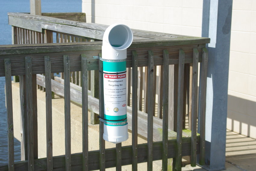 Monofilament recycling tube on fishing pier Stock Photo - Alamy