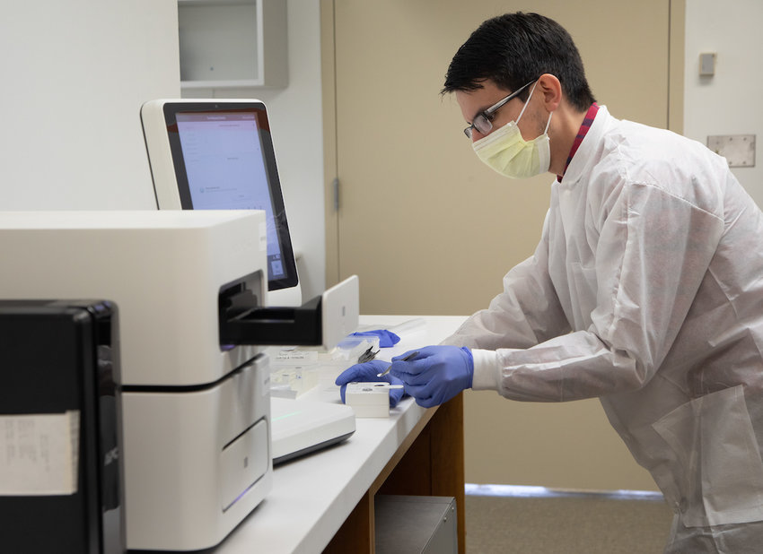 USA Health new single-gene cancer testing taking place in the Molecular Diagnostic Lab -.Doug Hebert, Ph.D., pathology molecular medical scientist, prepares a sample for testing.