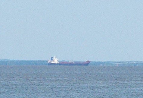 A ship moves through the ship channel in Mobile Bay. The U.S. Army Corps of Engineers plans to use material dredged from the channel to create a wetlands area south of the Causeway.