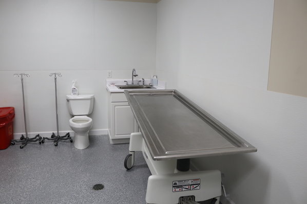 An examination table in the Baldwin County Coroner's Office. The number of cases investigated by the office increased from 460 in 2019 to 660 in 2021.