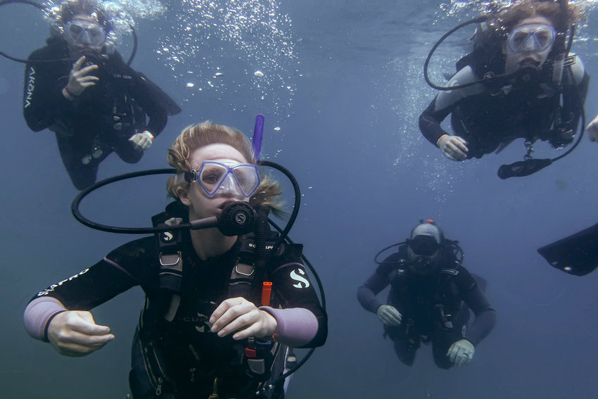 Reagan Lentz, bottom left, and other seniors from Central Christian School swim through the water at Vortex Springs, near Ponce De Leon, Florida, during a dive class led by Bryan Enslava, of Down Under Dive Shop.