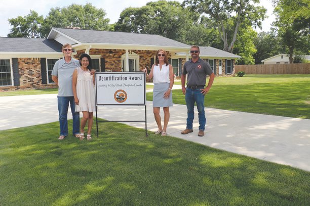 The Thomas family received the June Yard of the Month award from the Bay Minette Beautification Committee.