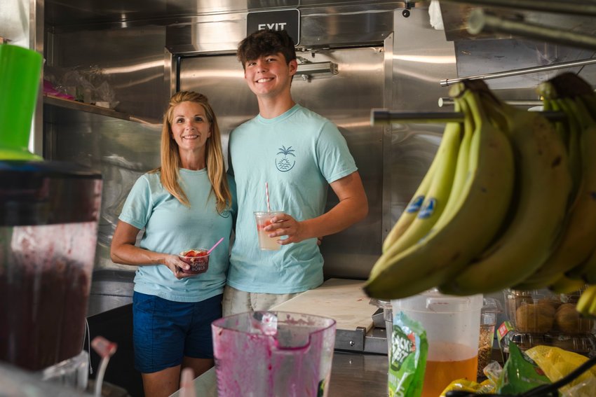 Janese Nelsen and her 16-year-old son, Brady, work the pink truck at Pirate's Cove RV Resort in Foley while Josh Nelsen worked the blue truck in Spanish Fort.