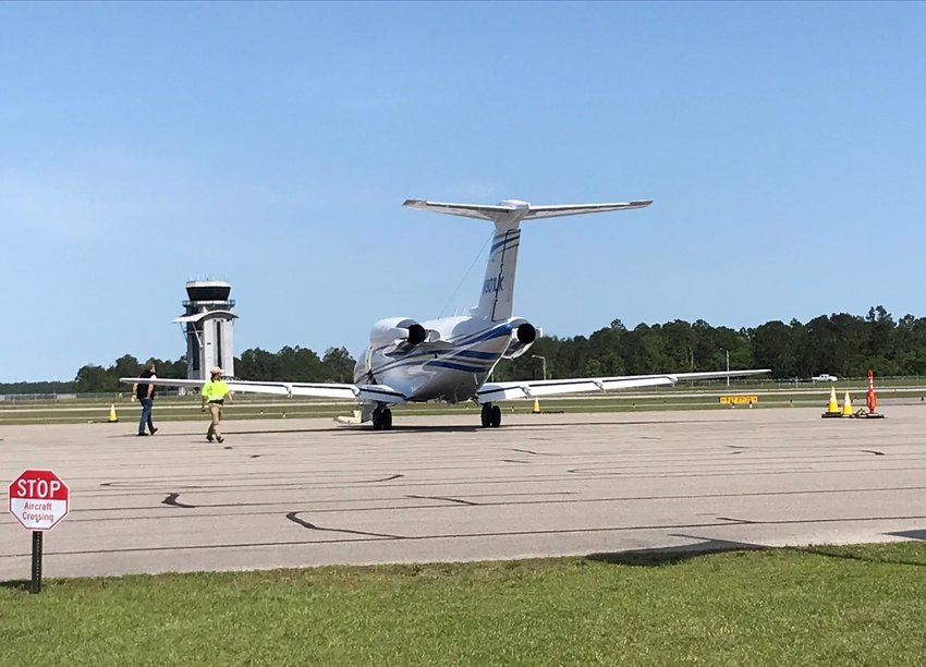 An airplane prepares to take off from the Gulf Shores International Airport. The Airport Authority has been selected as one of 25 in the United States to receive a $500,000 federal grant for airport improvements.