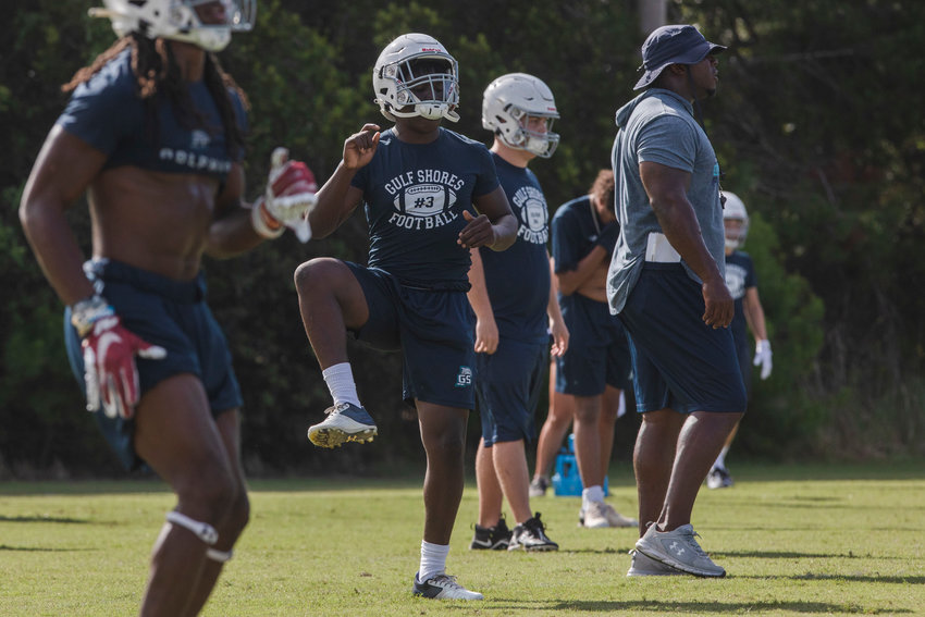 The Gulf Shores Dolphins stretch at the beginning of their first practice of the fall camp season Aug. 1 at the high school. The Alabama Sports Writers Association tabbed Gulf Shores the No. 8 Class 5A team in its preseason poll.