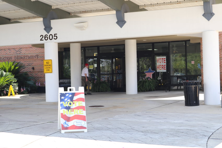 A Daphne voter goes to the polls Tuesday at the Daphne Civic Center. Voters approved a three-mill tax increase to support schools in the Daphne area.