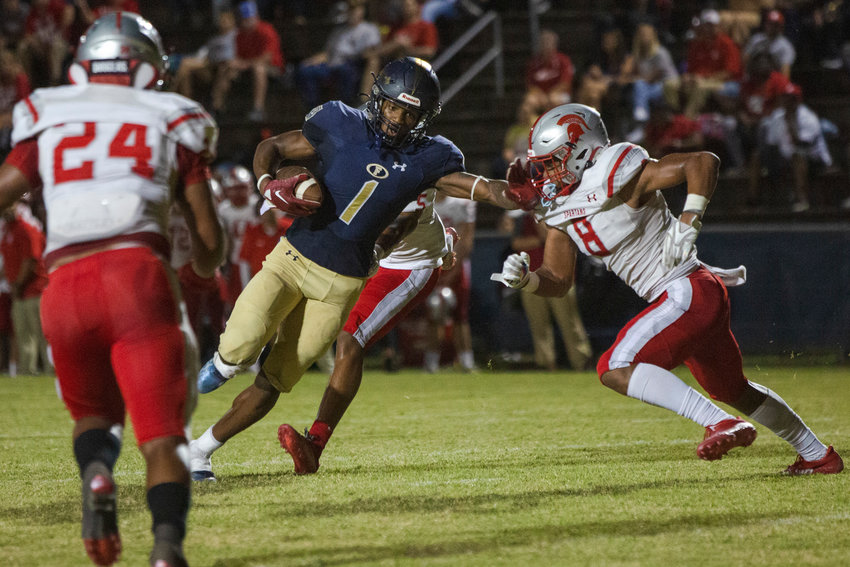 Foley receiver Perry Thompson runs with a catch during the Lions&rsquo; non-region game against the No. 3 Saraland Spartans at Ivan Jones Stadium Friday, Sept. 23. The Alabama commit threw a touchdown to Makai Mitchell and caught nine passes for 87 receiving yards in Foley&rsquo;s 49-21 loss.