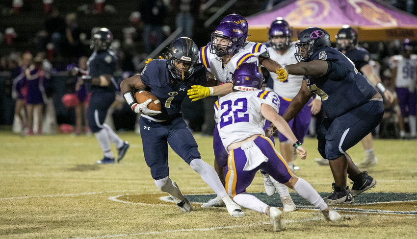 Foley junior Perry Thompson looks for yards after the catch during the Lions&rsquo; Class 7A Region 1 title game against the Daphne Trojans on Smith-Pigott Field at Ivan Jones Stadium Friday night. Foley won 34-7 to claim its first region crown since 2007.