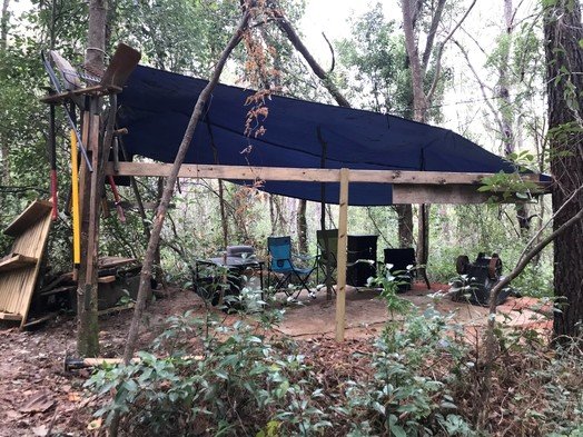 A shelter built in the Triangle property includes chairs and work tools. City officials said individuals have been going onto the city-owned site and building bike trails without authorization.