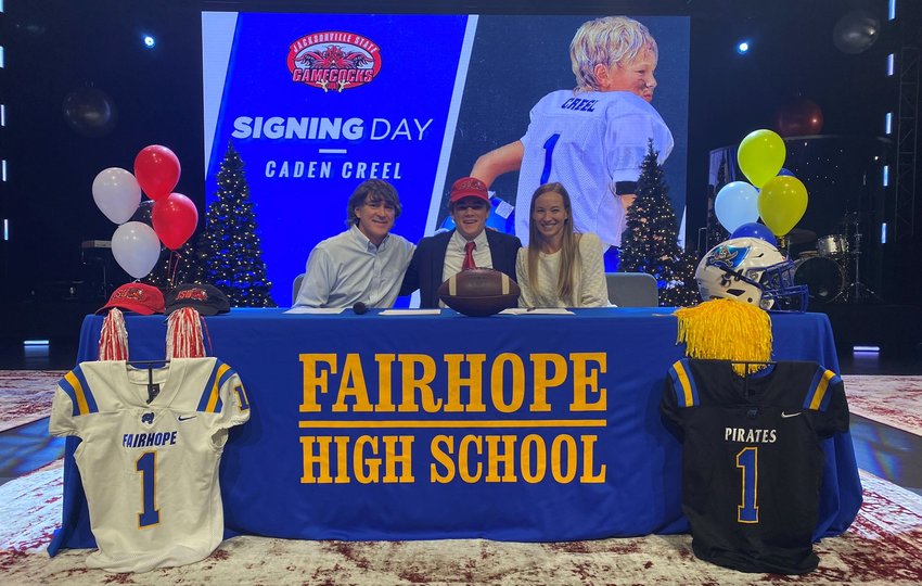 Caden Creel was joined by his parents, family and friends in signing in National Letter of Intent to join the Jacksonville State Gamecock football program during a Dec. 21 ceremony at 3Circle Church in Fairhope. The Pirates&rsquo; dual-threat quarterback collected over 3,000 yards throwing and passing as a senior.