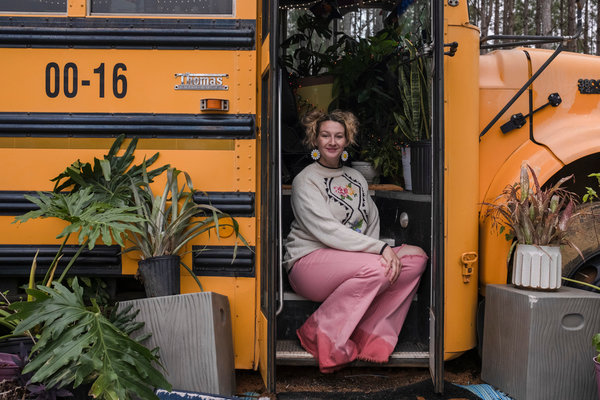 Kitti Cooper in the door of her bus turned classroom at Cooper Farm prior to teaching one of her Organic Gardening classes. Cooper Farm will celebrate the opening of the new farm this weekend.