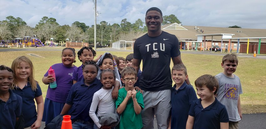TCU running back and Daphne alumnus Trent Battle visited Daphne Elementary School this week while on break from school fresh off the national championship game. Battle became the third former Trojan to play for college football&rsquo;s national title in the last 10 years.