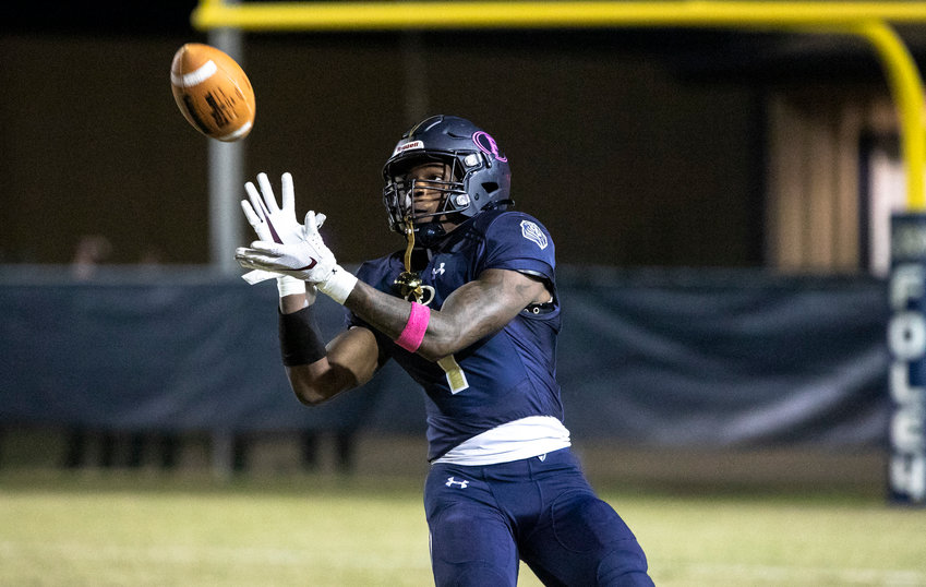 Foley junior Perry Thompson looks in a punt during the Lions&rsquo; Class 7A Region 1 game against the Daphne Trojans at Ivan Jones Stadium Oct. 21, 2022. Thompson was one of 16 Foley Lions named all-county by Baldwin County Public Schools.