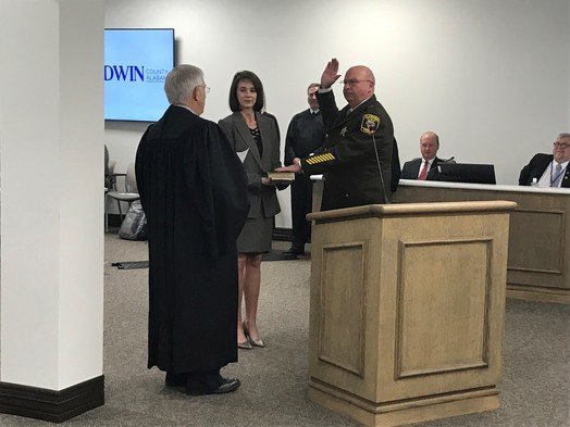Baldwin County Sheriff Huey &quot;Hoss&quot; Mack takes the oath of office to start his fifth term as sheriff. Mack, Coroner Brian Pierce and Circuit Judge Scott Taylor were sworn in for new terms during a Jan. 17 county commission meeting.
