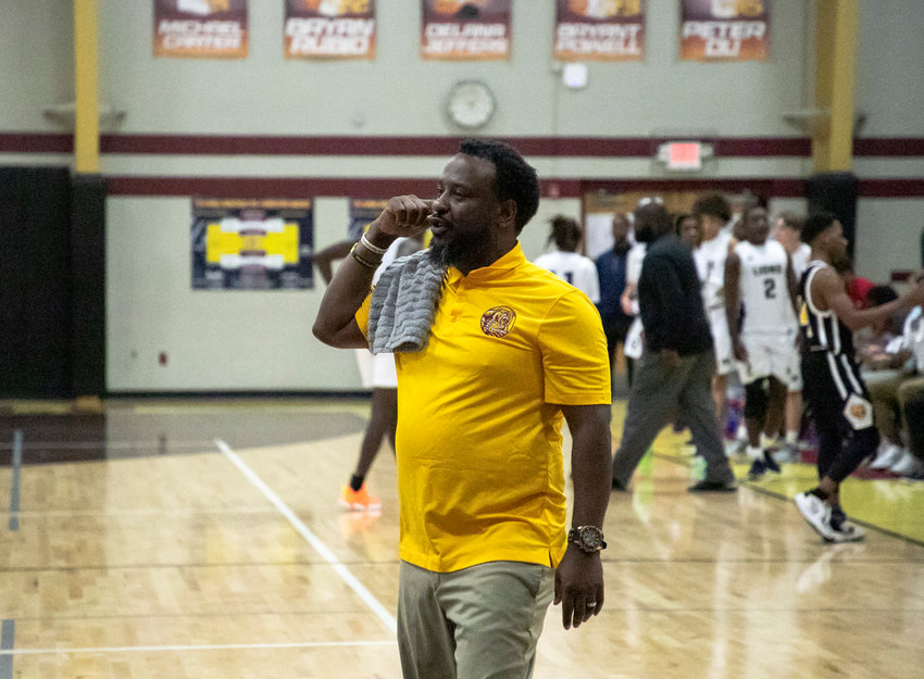 Robertsdale head boys&rsquo; basketball coach Marshall Davis signals to his team during the Pre-Thanksgiving Tournament game against the Foley Lions at home Nov. 19, 2022. With the Golden Bears&rsquo; 57-43 win over Baldwin County Friday night, Davis collected his 200th career win where all have come in Robertsdale.