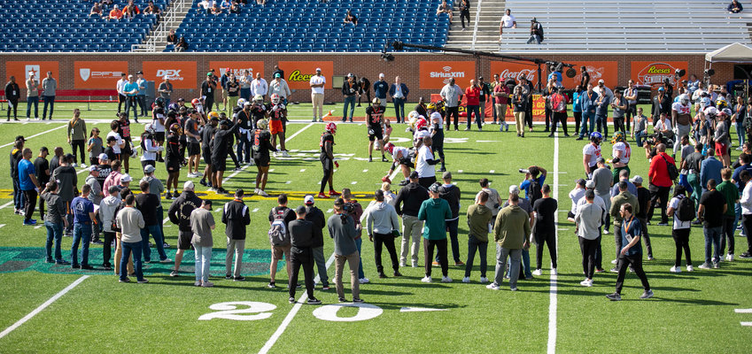 Scouts watch college football all-stars go through workouts at the Jan. 31 practice during the 2023 Reese&rsquo;s Senior Bowl at Hancock Whitney Stadium in Mobile. The game recently announced its scouring staff for the 2024 game cycle.