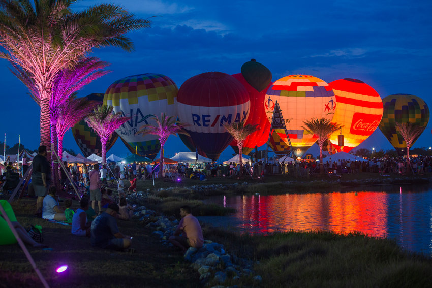 Balloons light up the dusk sky in Foley at the Gulf Coast Hot Air Balloon Festival in 2022.