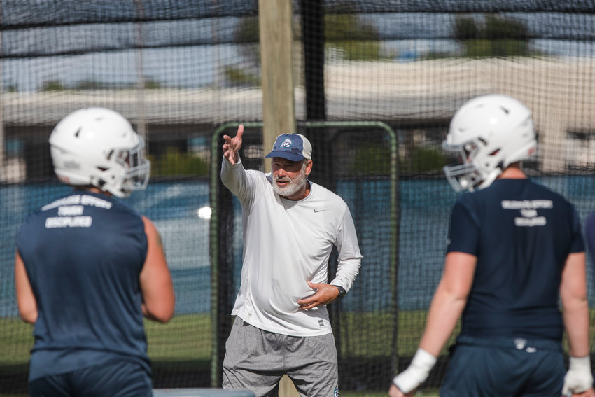 Paul Rhoads communicates with the Gulf Shores defense during the first padded practice of the season Aug. 1, 2022, at the high school. Friday it was announced Rhoads will be joining the staff at Boston College after one year as the Dolphins&rsquo; defensive coordinator.