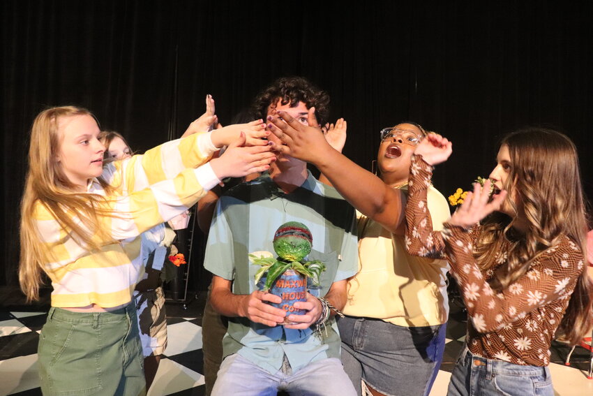 Pictured left to right are Spanish Fort High students Kyla Berry, Parker Pitre, Madison London, Mackenzie Nero, Mia McKray, and Hayden Taylor (center) as they rehearse a scene from &quot;Little Shop of Horrors.&quot;