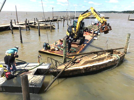 Workers remove boats sunk at the Fairhope Pier after Hurricane Sally in 2020. Hurricane season begins June 1. Learn more about being prepared at the Severe Weather Preparedness Town Hall in Robertsdale.