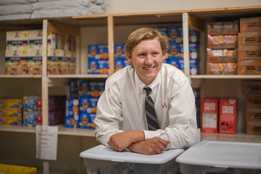 Austin Gontraski, seen here at Catholic Social Services in Robertsdale, held a neighborhood food drive in sixth grade, collecting $400 in cash to buy 1,200 meals. He delivered the food to CSS and has been working with them since.