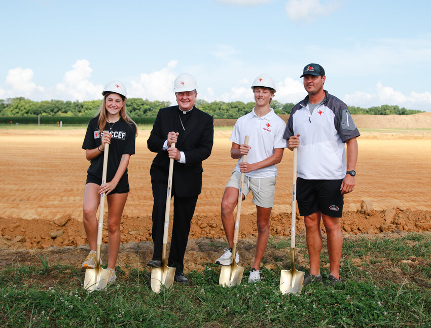 St. Michael school official, student athletes and head football coach Philip Rivers breaking ground at the new soccer and football field