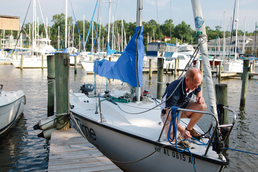 Christopher Jones, owner of SailTime Alabama, ensures a member's sailboat is secure at the Fairhope Docks where the state's only sailboat school operates out of. Adventure seekers can take certified sailing classes through the American Sailing Association right in Baldwin County.