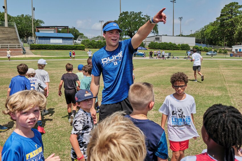 Former Fairhope quarterback and current Duke signal-caller Riley Leonard directs campers at the inaugural youth camp held at W. C. Majors Field Saturday, June 17.