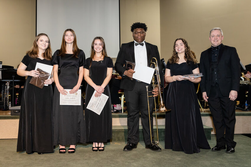 Pictured from left to right: Carolyn Lippold, second place; Julia Wofford, honorable mention; Ashleigh Kiesel, honorable mention; Kayin Hardy, third place; Olivia Tures, first place; and Baldwin Pops Band Conductor Wayne Fillingim.