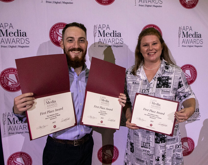 Cole McNanna, sports editor, and Melanie LeCroy, lifestyle editor, hold Gulf Coast Media&rsquo;s three first-place awards the newspaper company took home  from the Alabama Press Association&rsquo;s Summer Convention on Saturday, June 24. McNanna won for his use of social media and for sports photo, and LeCroy won for business writing.