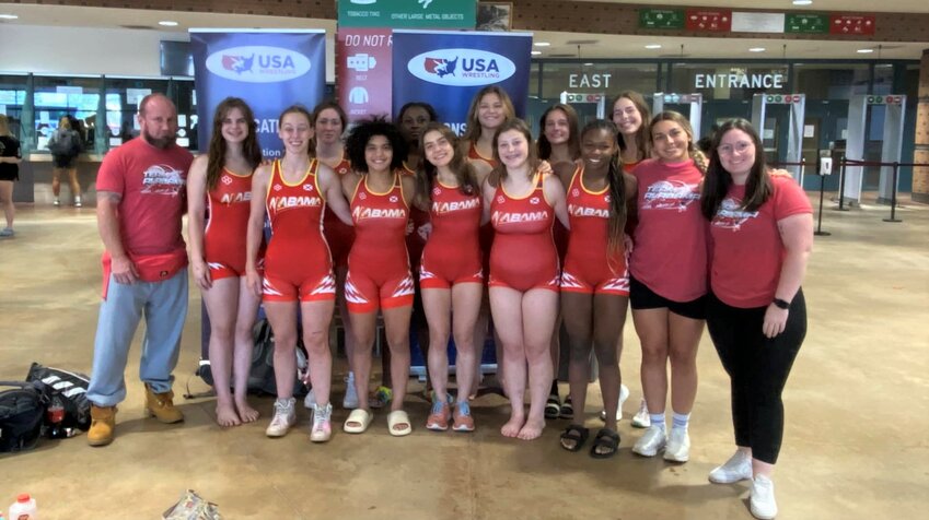 Team Alabama poses for a picture at the women&rsquo;s 16U and Junior Nationals in Fargo, North Dakota, on Saturday, July 15. Three Baldwin County wrestlers competed on the squad, including Daphne&rsquo;s Kalyse Hill, Spanish Fort&rsquo;s Abigail Pendergrass and Gulf Shores&rsquo; Leah Guthrie. Also pictured are Evelyn Holmes-Smith, Haley Pate, Teegan Robinson, Elizabeth Rosenstiel, Emily Hill, Tristin Robinson, Aniyah Griffin and Mallory Ladd alongside coaches Lillian Humphries, Kyle Stiffler and Yasmine Oliveira.