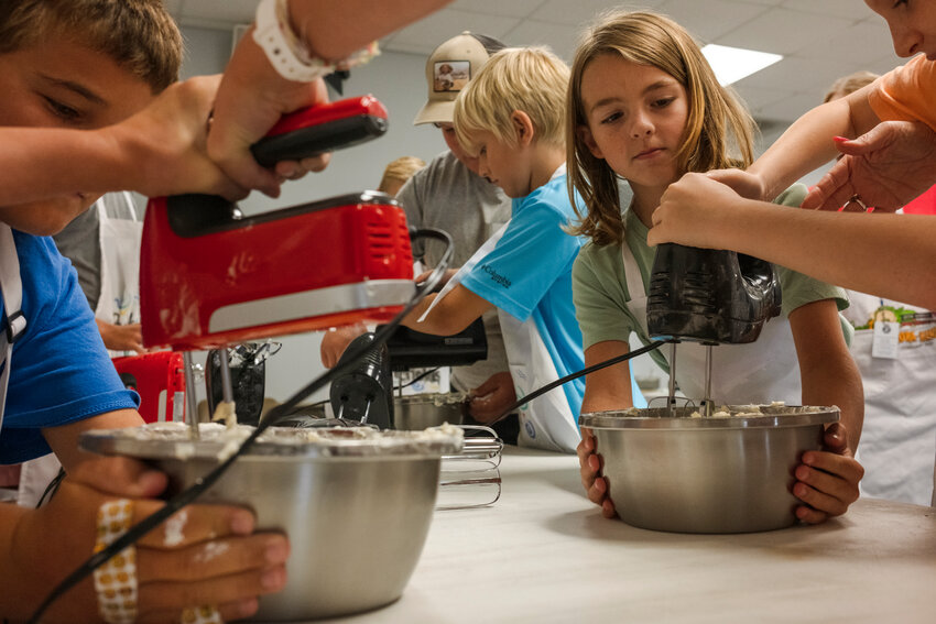 Campers mix ingredients during this year's Expect Excellence Culinary Camp. The brainchild of Jonathan and Jessica Langston sells out quickly every  year, with kids eager to learn how to cook and bake while also gaining knowledge about food safety and potential industry jobs.