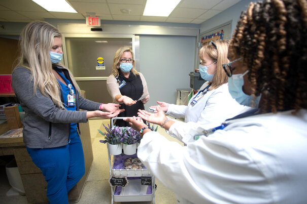 Kim Crawford-Meeks, spiritual care manager and chaplain for USA Health, administers a Blessing of the Hands to nurses USA Health University Hospital.