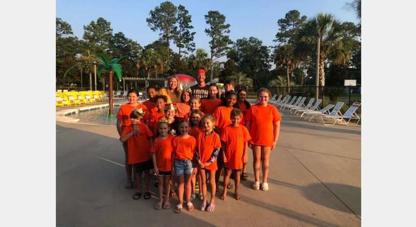 The Bay Minette Tiger Sharks swim team celebrated their second-place finish at the City Meet with a party at the municipal pool. Coaches Daylen, Luke, and Patrick also handed out team awards.