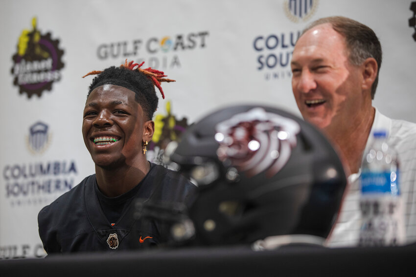 Baldwin County athlete Ti Mims and Tiger head football coach Scott Rials react to one of the non-football questions asked during the second-annual Gulf Coast Media Day at the Orange Beach Event Center on July 27. Rials said Mims and the receivers could be one of the team&rsquo;s strengths in 2023.