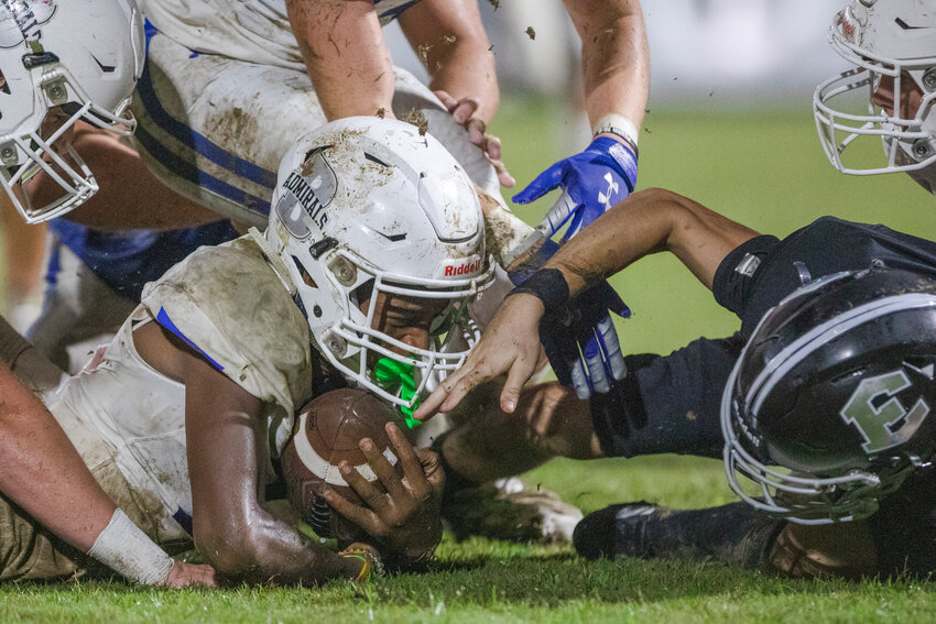 A muddy play comes to a halt during the season-opening game between the Bayside Academy Admirals and Elberta Warriors on Aug. 19, 2022, at John T. Cobb Stadium in Elberta. This year&rsquo;s season-opening contest is set for Freedom Field in Daphne this Friday night.
